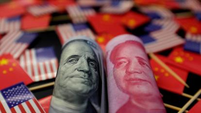 FILE PHOTO: Illustration picture showing U.S. dollar and China's yuan banknotes