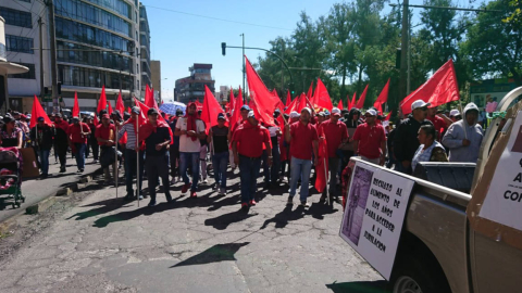 Un grupo de trabajadores durante la marcha del 1 de mayo de 2019, en Quito.