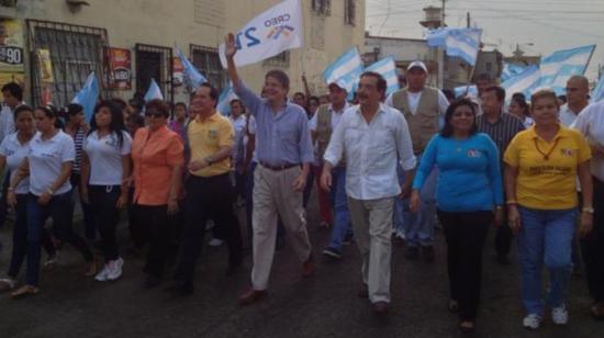 En noviembre de 2012, los entonces candidato presidencial Guillermo Lasso y alcalde de Guayaquil, Jaime Nebot, en un recorrido por el Guasmo Sur.